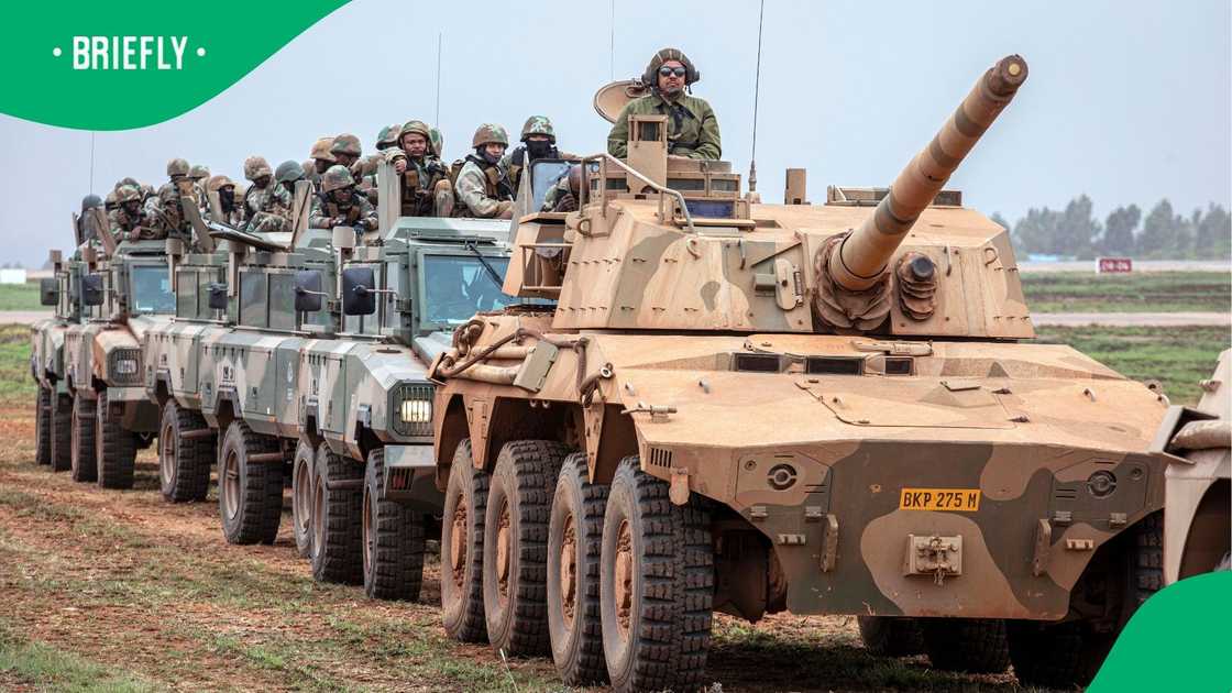 South African National Defence Force troops on the move. South African National Defence Force troops on the move.