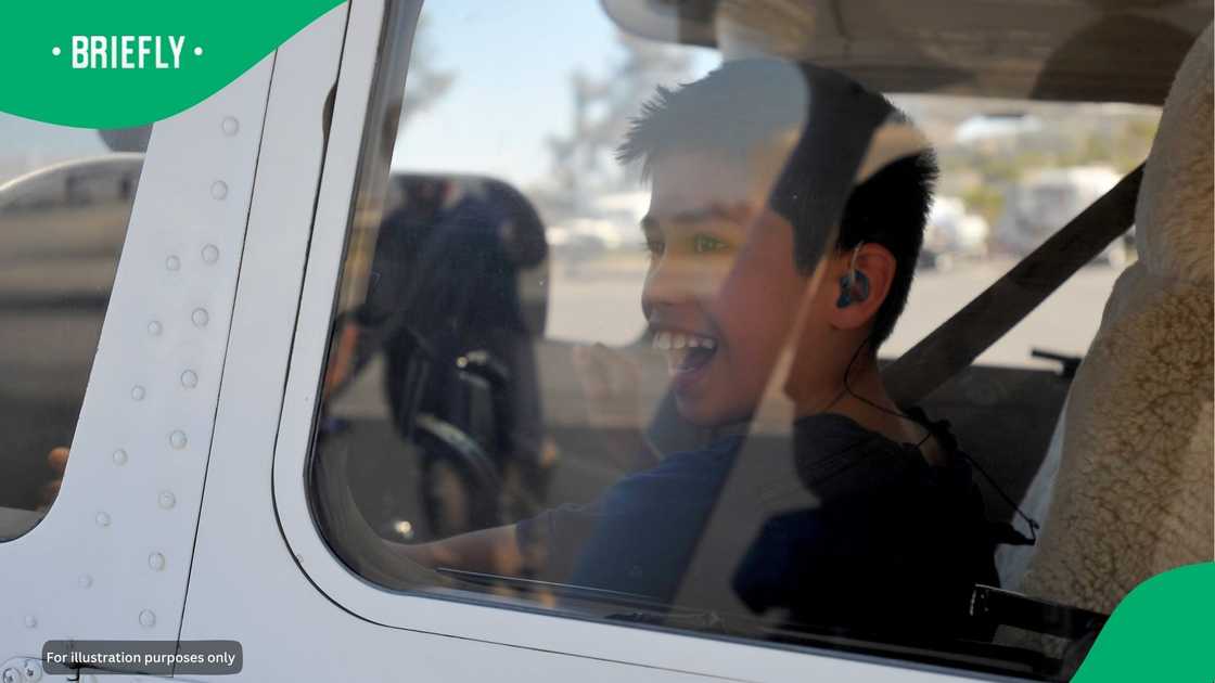 A boy in a plane. A boy in a plane.