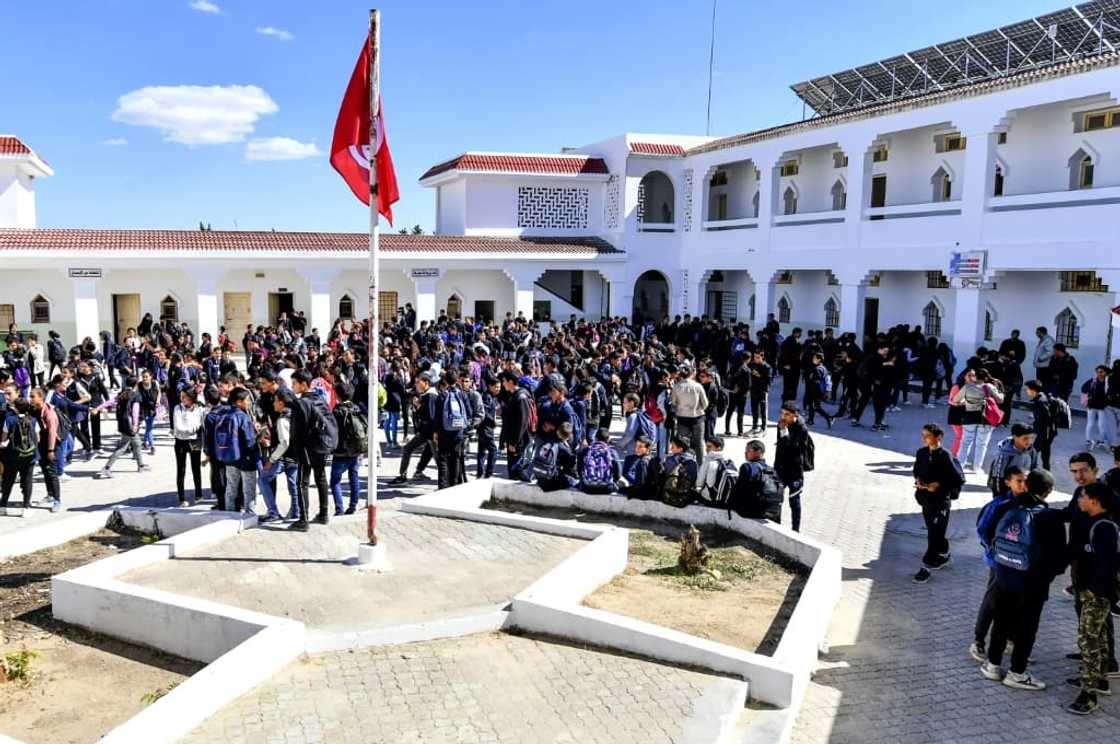 Pupils gather in the playground of the Makhtar boarding school, located in a remote and poor region 170 kilometres (100 miles) southwest of the capital