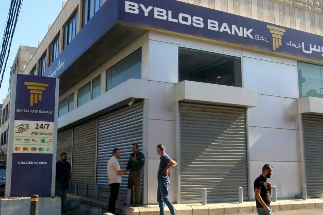 A Lebanese man carrying a gun and a jerrican of fuel withdrew his frozen savings at gunpoint Friday, the third such incident in the crisis-hit country this week A Lebanese man carrying a gun and a jerrican of fuel withdrew his frozen savings at gunpoint Friday, the third such incident in the crisis-hit country this week