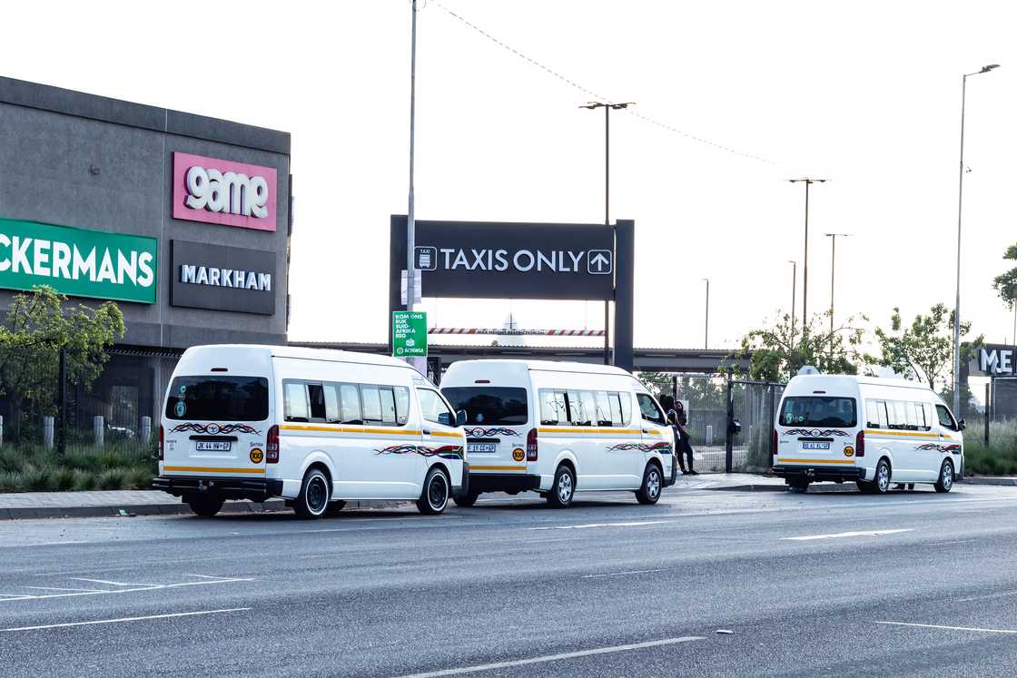 Minibus taxis in the road Minibus taxis in the road