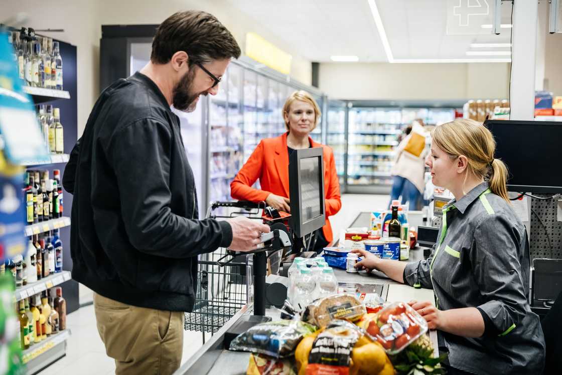 Shoppers were photographed in a grocery store Shoppers were photographed in a grocery store