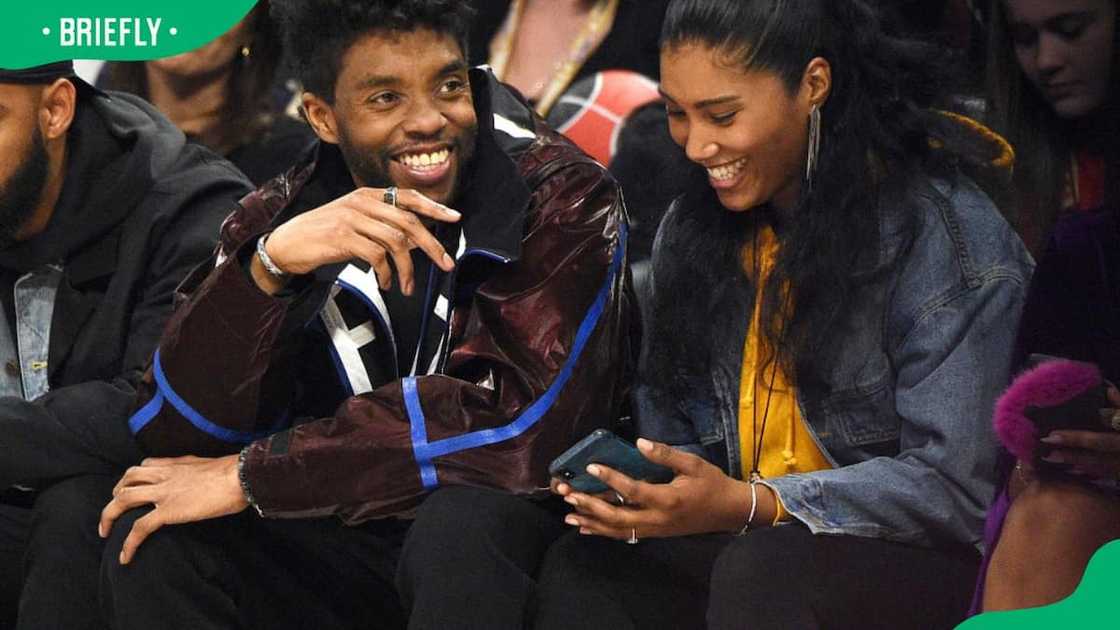 Chadwick Boseman and Taylor Simone Ledward during the 69th NBA All-Star Game in 2020 Chadwick Boseman and Taylor Simone Ledward during the 69th NBA All-Star Game in 2020