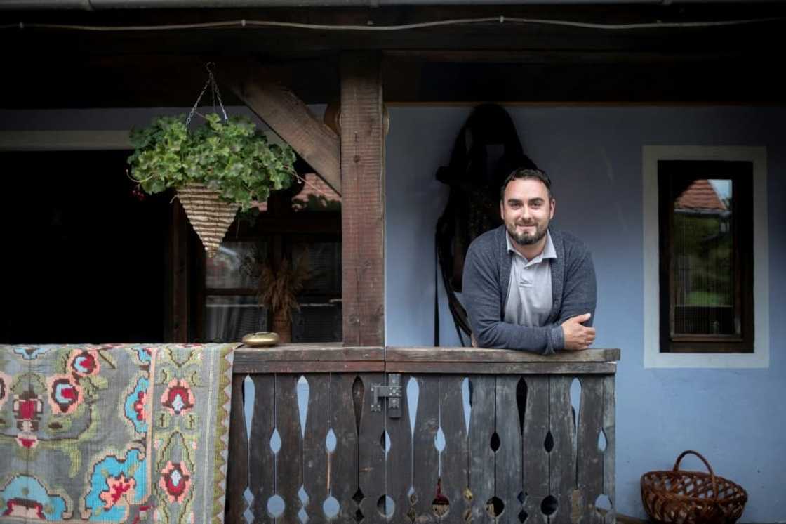 Welcome: farmer Radu Moldovan in front of his guesthouse in the remote village of Sapartoc