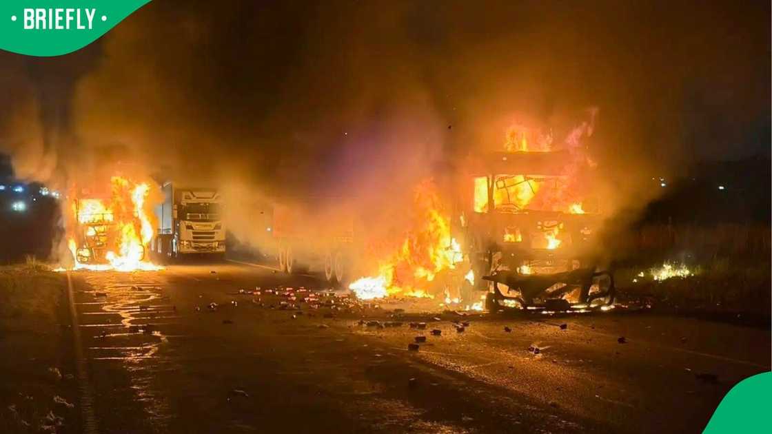 The vehicles were set alight during the attack The vehicles were set alight during the attack