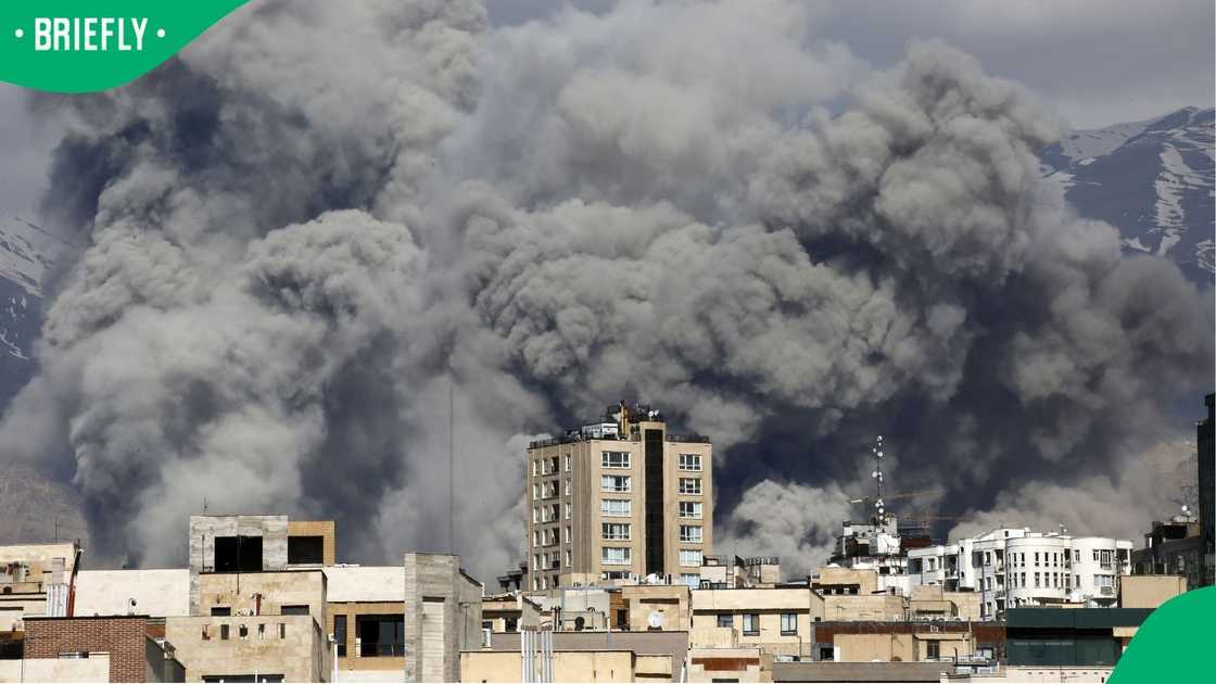 Smoke rises from and area in Tehran after it was targeted in attacks Smoke rises from and area in Tehran after it was targeted in attacks