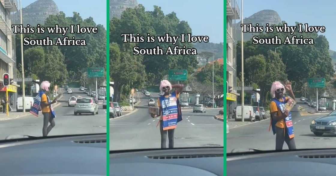 Man in pink wig entertaining drivers