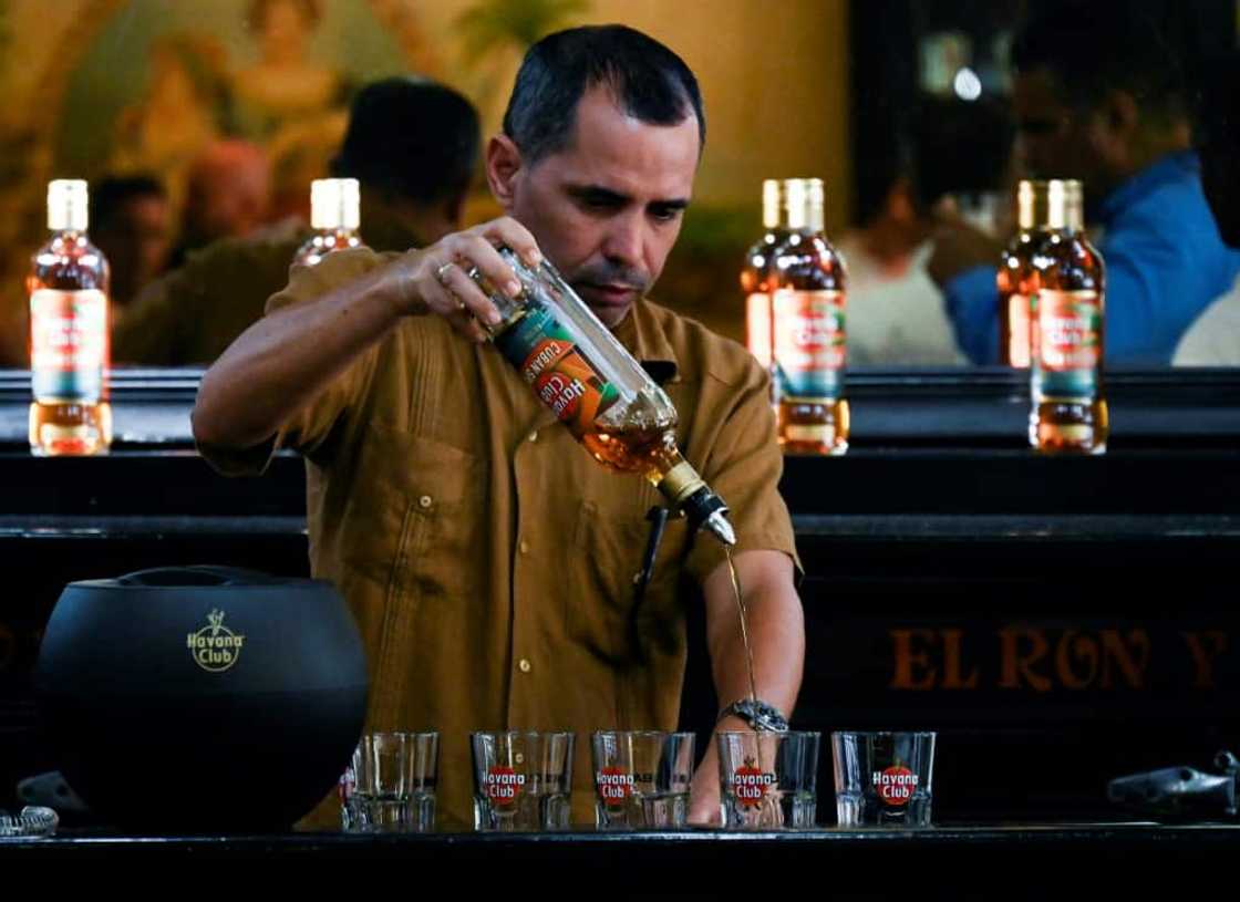 A bartender serves the new Havana Club Cuban Spiced rum at Havana's rum museum on November 15, 2022