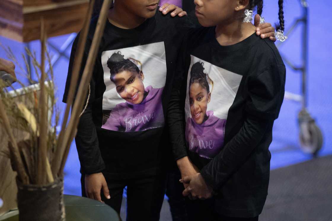 Children wear shirts with photos of Esmine Francke, who was killed in a gang shooting on the Cape Flats Children wear shirts with photos of Esmine Francke, who was killed in a gang shooting on the Cape Flats