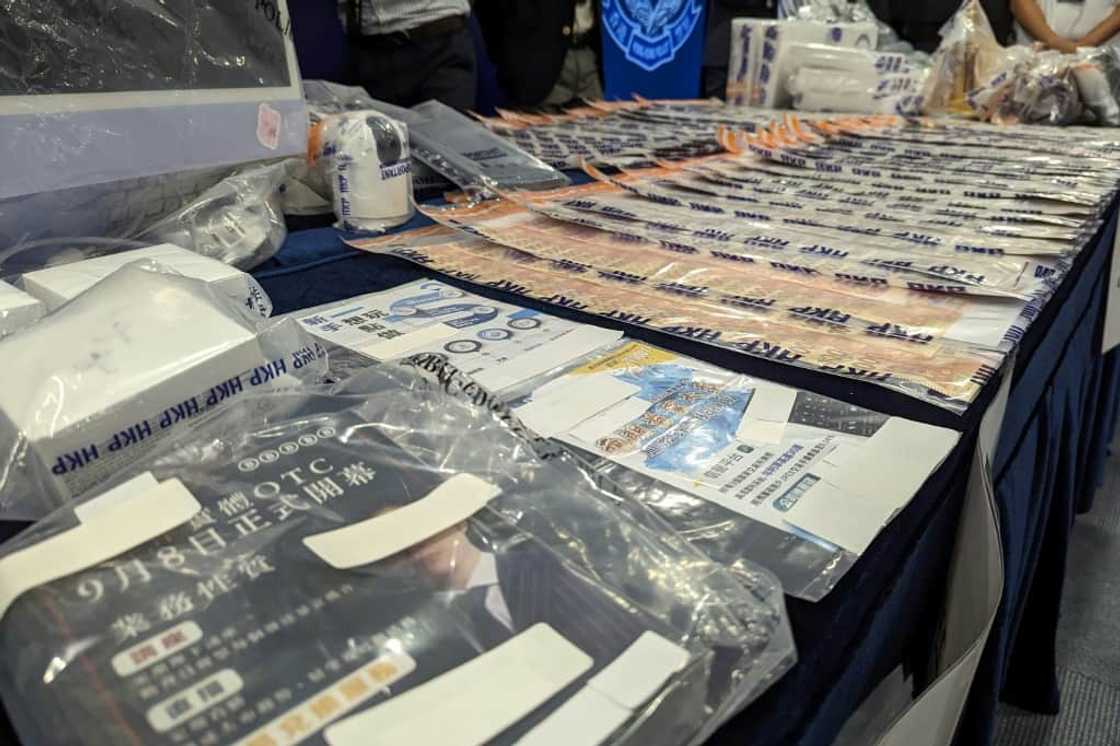 Police on Monday conducted a high-profile raid of 20 premises, seizing cash, computer equipment and luxury handbags Police on Monday conducted a high-profile raid of 20 premises, seizing cash, computer equipment and luxury handbags