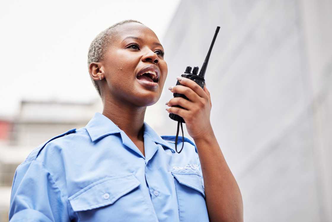 a female traffic officer talking on radio a female traffic officer talking on radio