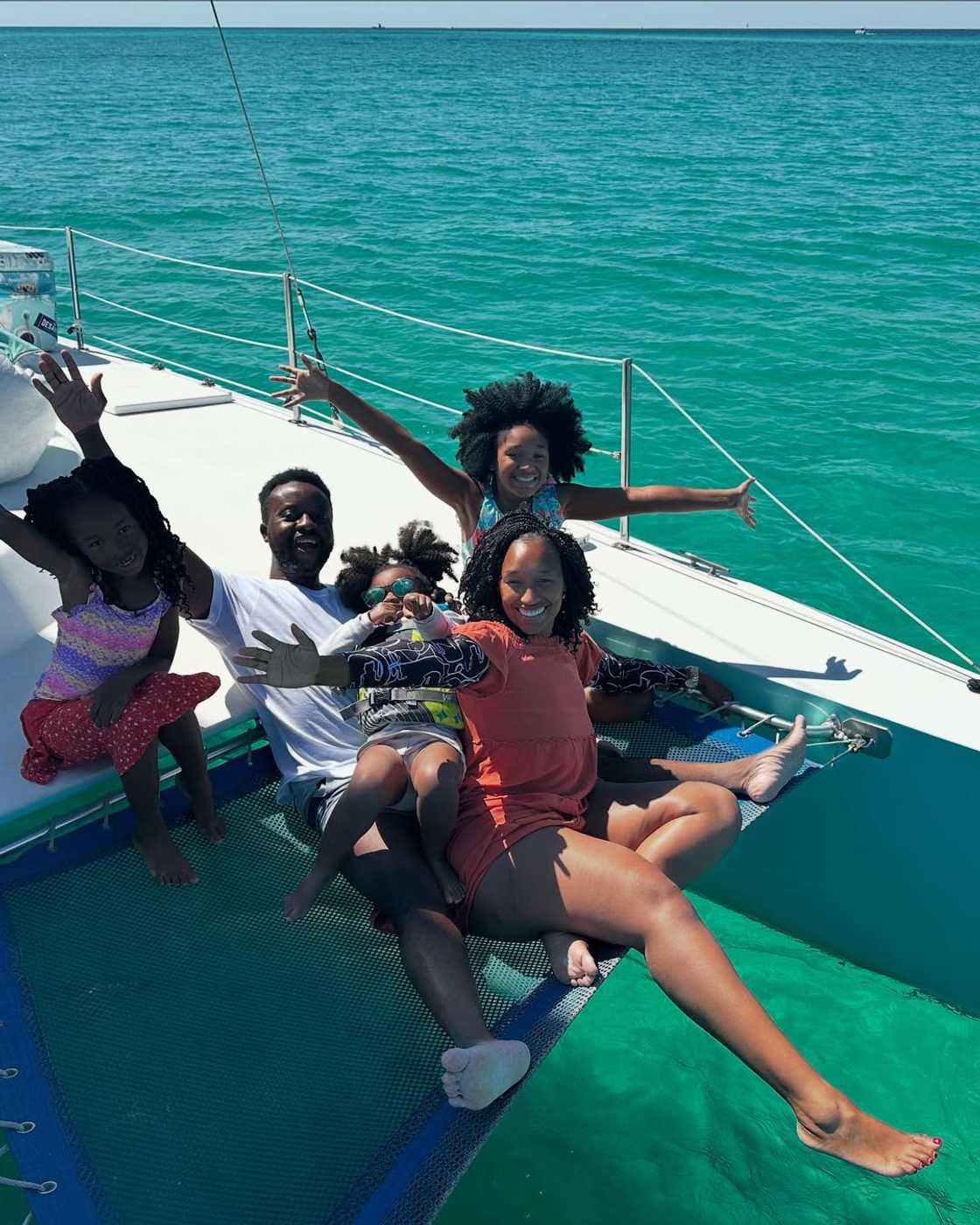 An American family enjoying themselves on a boat.
