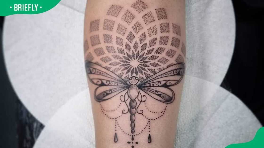 Tribal dragonfly tattoo with mandala prints Tribal dragonfly tattoo with mandala prints