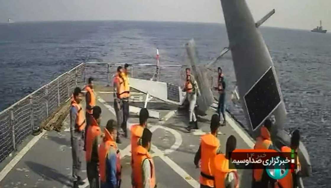Iranian sailors aboard a destroyer with two US Navy Saildrone unmanned surveillance vessels in the Red Sea. The Iranians gave them back to the US Navy. Iranian sailors aboard a destroyer with two US Navy Saildrone unmanned surveillance vessels in the Red Sea. The Iranians gave them back to the US Navy.