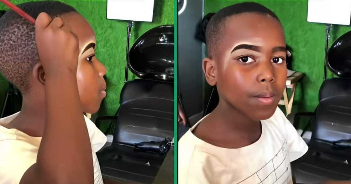 A TikTok video shows a little boy applying makeup on his face. A TikTok video shows a little boy applying makeup on his face.