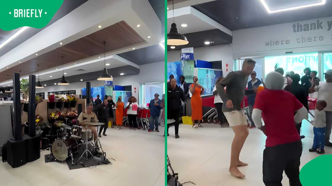 Spar shopper and staff dance to live drummer Spar shopper and staff dance to live drummer
