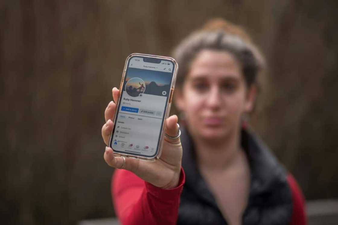 Ruby Hammer shows off her Facebook profile near her home in Felton, California