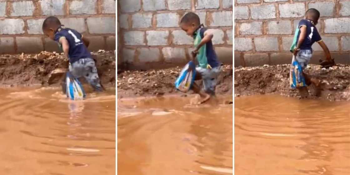 A boy walking in flooded streets with bread