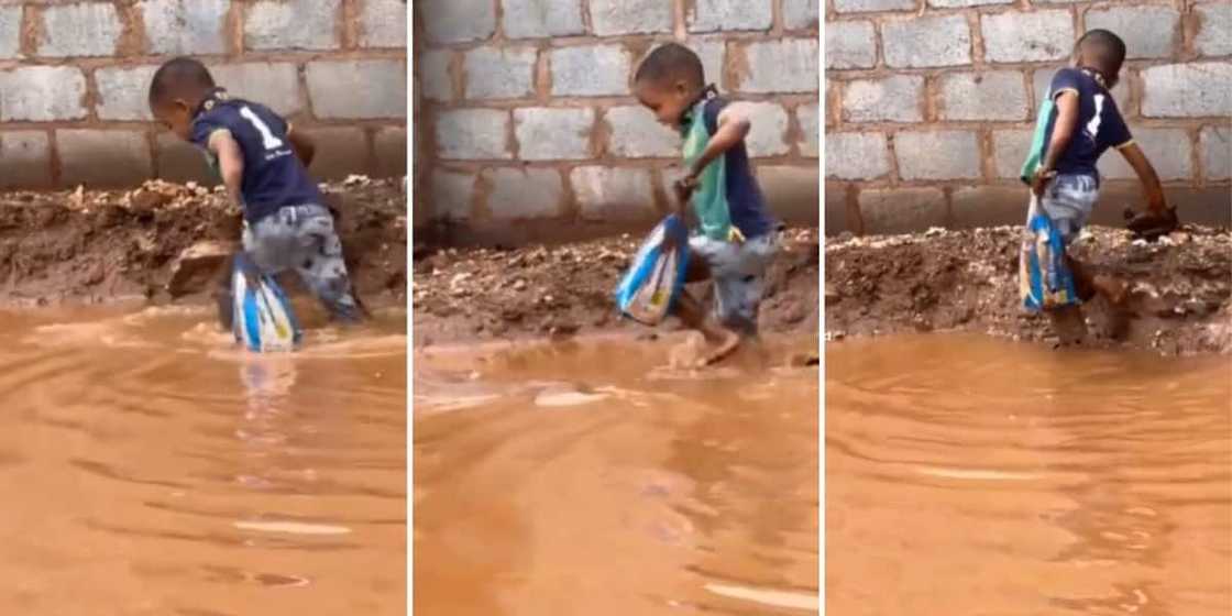 A boy walking in flooded streets with bread A boy walking in flooded streets with bread