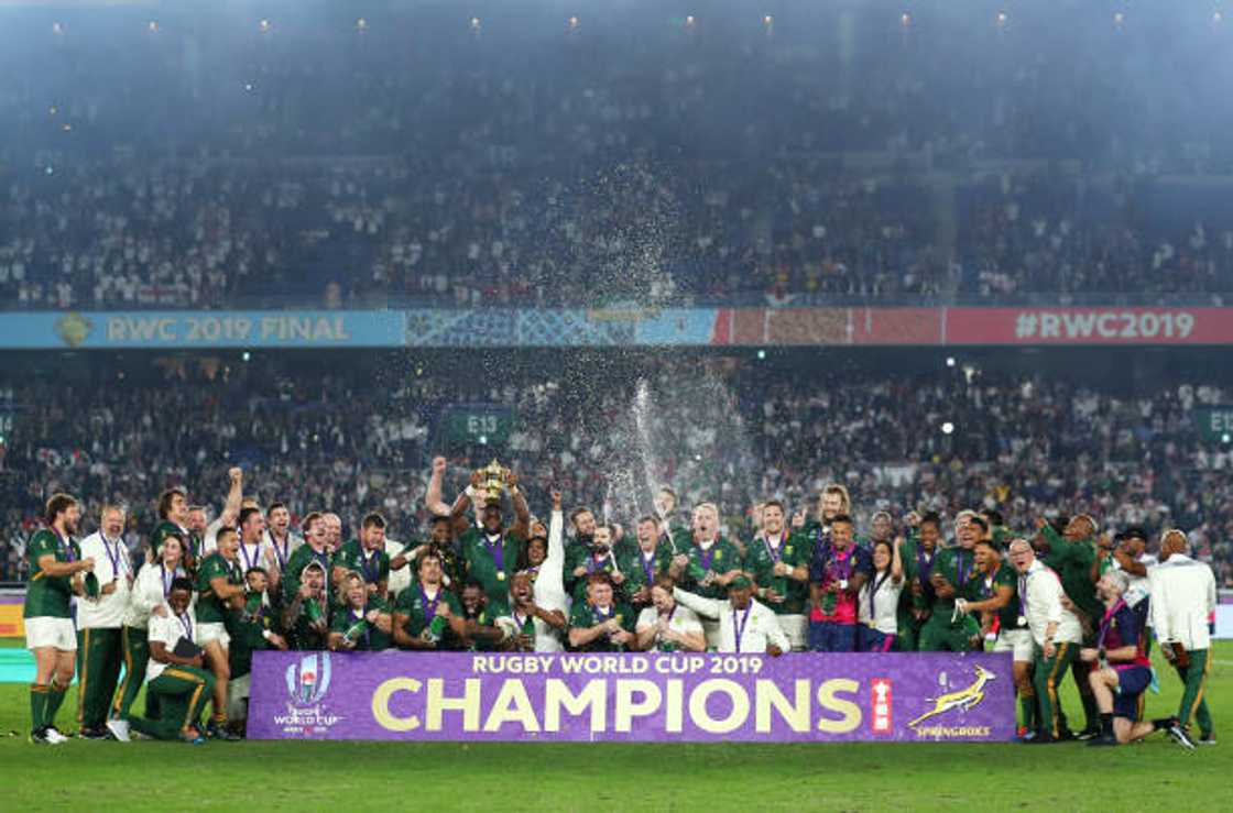 South African players celebrate as Siya Kolisi lifts the Web Ellis Cup after their victory over England in the Rugby World Cup 2019 Final at International Stadium Yokohama on November 02, 2019, in Yokohama, Japan. (Photo by Shaun Botterill/Getty Images)