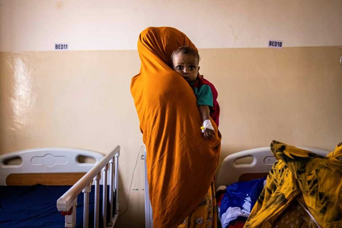 Hunger: A mother and her malnourished baby at the Banadir Maternity and Children Hospital in Mogadishu, the Somalian capital Hunger: A mother and her malnourished baby at the Banadir Maternity and Children Hospital in Mogadishu, the Somalian capital