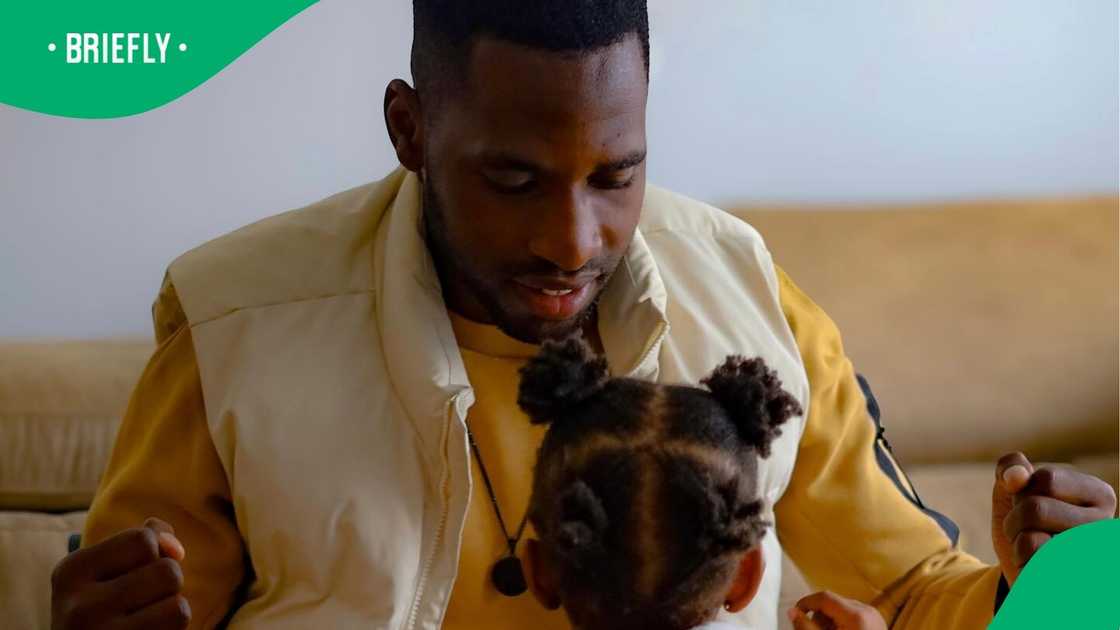 Fortune Makaringe spends time with his children. Fortune Makaringe spends time with his children.