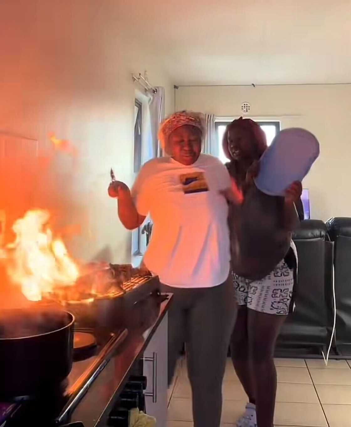 A fire broke out while women were braaiing their meat indoors, sparking mixed reactions online. A fire broke out while women were braaiing their meat indoors, sparking mixed reactions online.