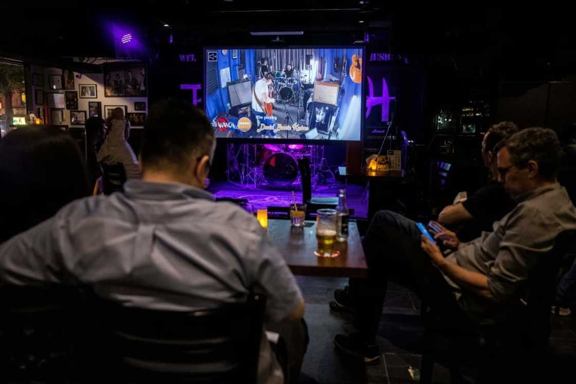 At Hong Kong bar The Wanch, the music was being live-streamed from a studio across town to obey pandemic rules At Hong Kong bar The Wanch, the music was being live-streamed from a studio across town to obey pandemic rules