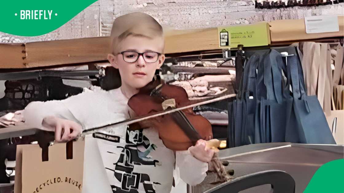 A TikTok user shared a video of a little man entertaining himself making music