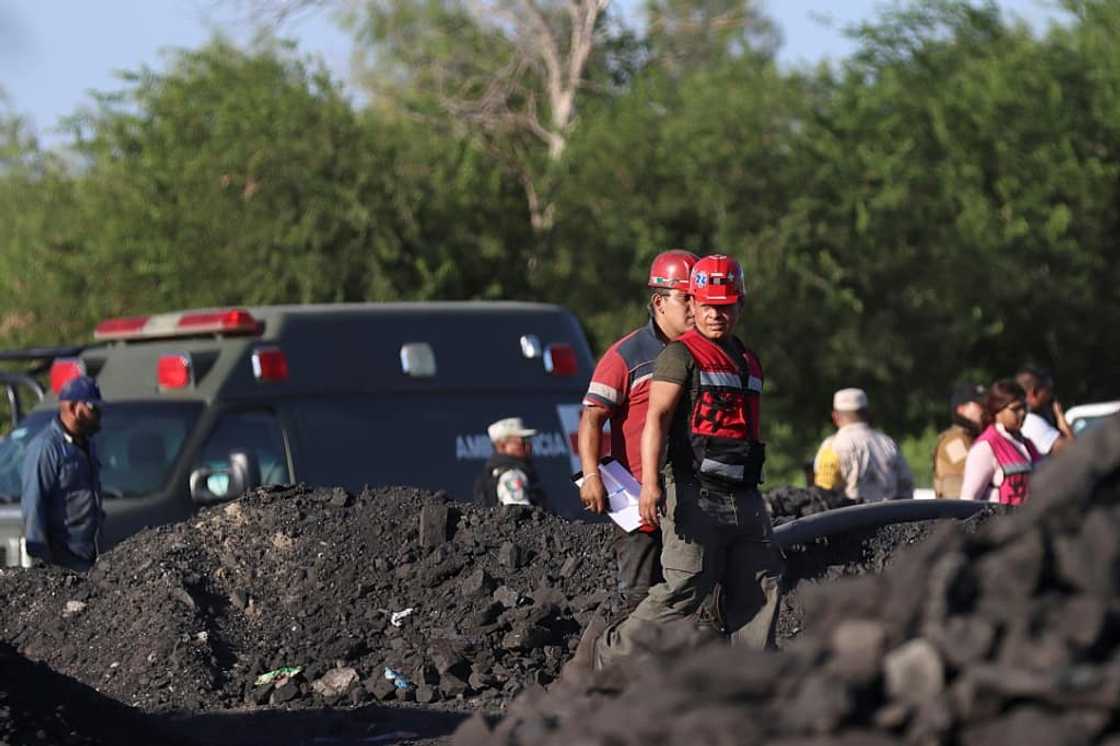 Rescue personnel work at a coal mine in northern Mexico where around nine people were believed to be trapped Rescue personnel work at a coal mine in northern Mexico where around nine people were believed to be trapped