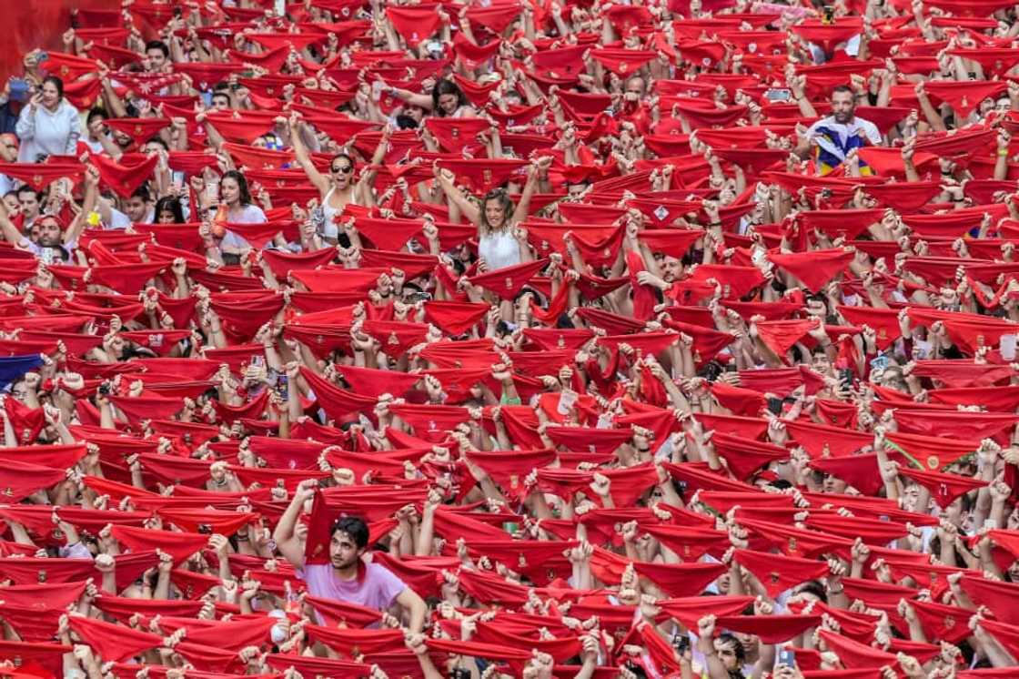 After the 'chupinazo' starting rocket was fired at midday from Pamplona town hall, thousands erupted in celebration After the 'chupinazo' starting rocket was fired at midday from Pamplona town hall, thousands erupted in celebration