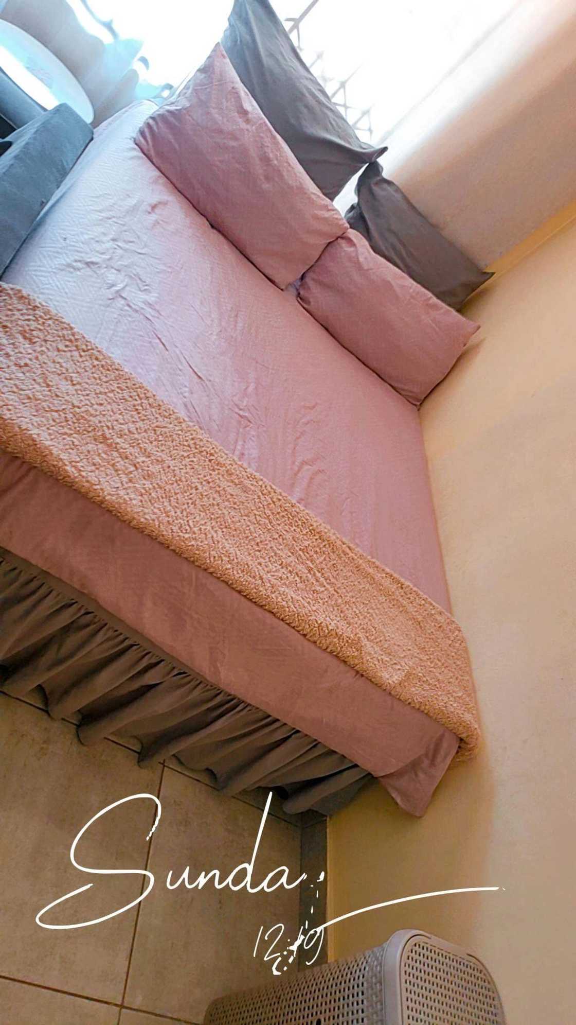 The bed is neatly made. The bed is neatly made.