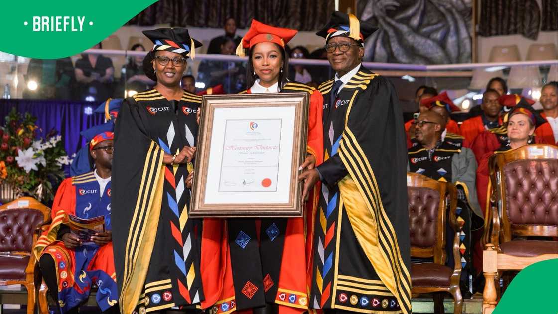 Dr Phuthi held her honorary doctorate certificate after being honoured by the Central University of Technology, Free State, marking a celebratory moment at the graduation ceremony.