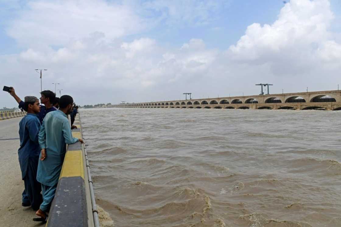 Water is already flowing into the streets of Sukkur, seeping through the walls of buildings along Bandar Road, which leads to the barrage