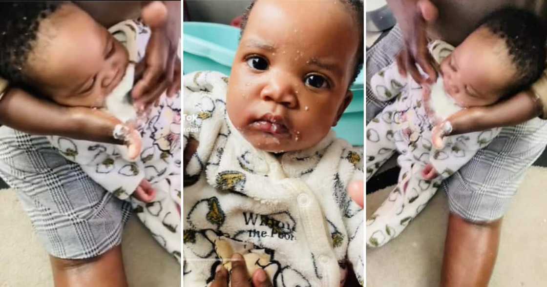 Baby being fed pap from his mothers hand Baby being fed pap from his mothers hand