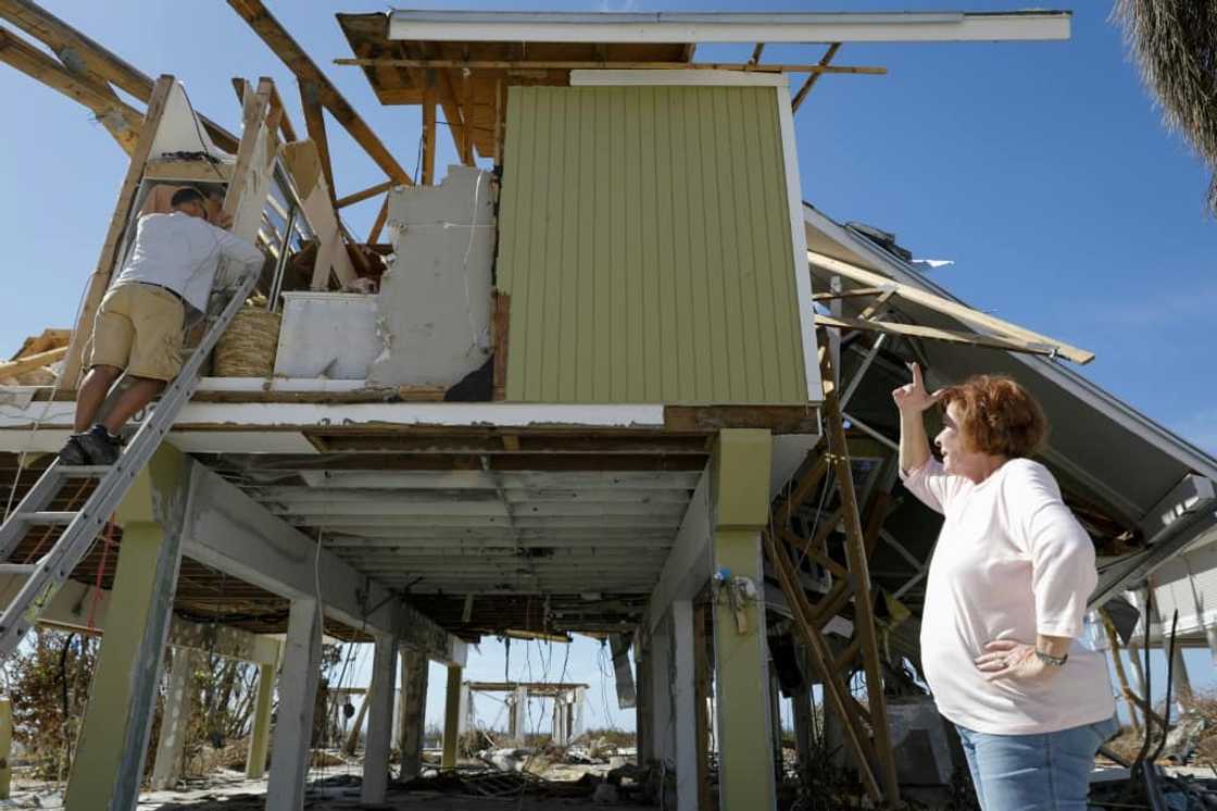 Homeowner Patty Kulkin looks at the wreckage caused by Hurricane Ian