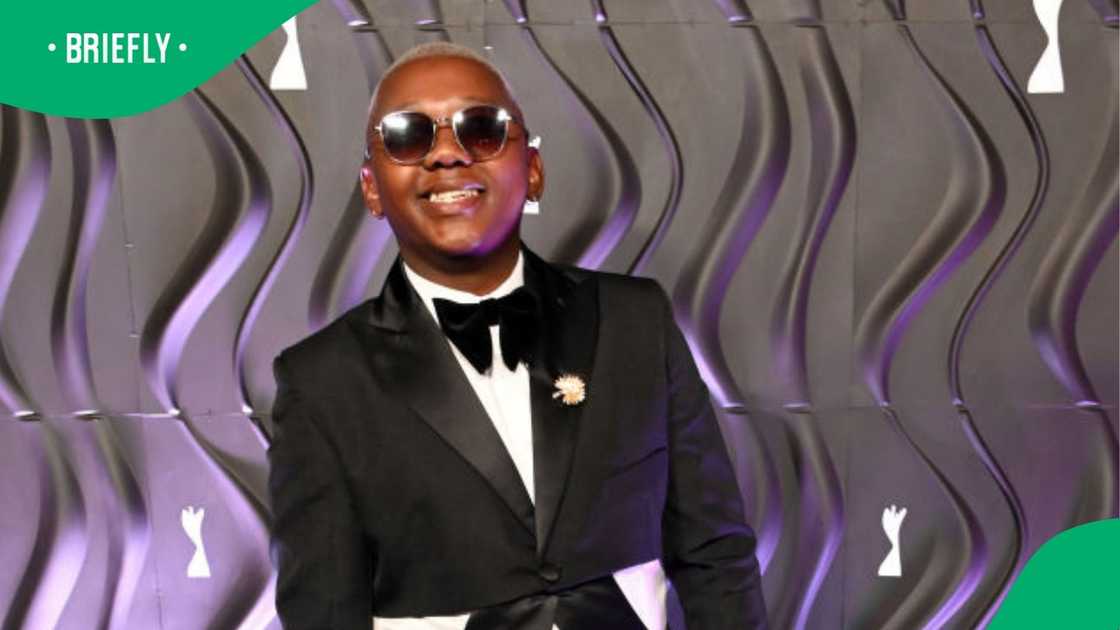 Aymos hands out flyers on rainy day Aymos hands out flyers on rainy day