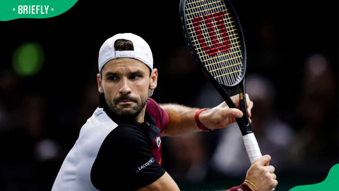 Grigor Dimitrov of Bulgaria in action against Stefanos Tsitsipas of Greece