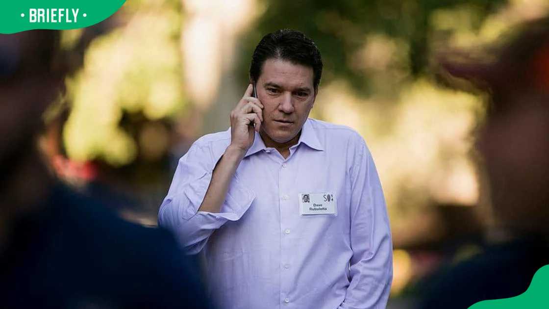 Rubulotta, a managing director at Citigroup, talks on the phone while arriving at the Allen & Co. Media