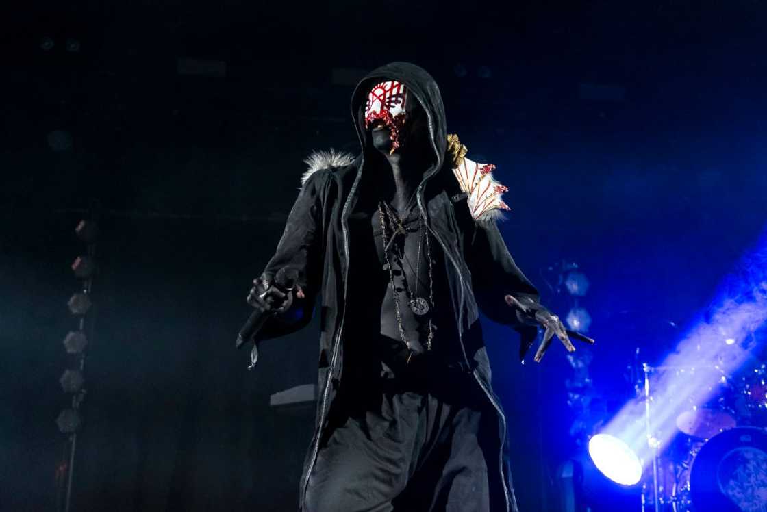 Vessel of Sleep Token performing on stage Vessel of Sleep Token performing on stage