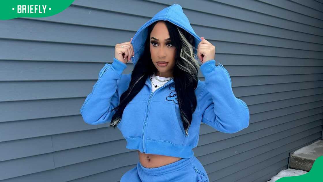 Emma Alayo in a blue outfit. Emma Alayo in a blue outfit.