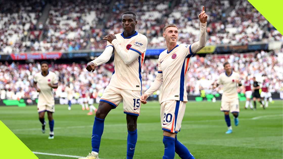 Nicolas Jackson celebrates with Cole Palmer after the striker scored Chelsea's second goal.