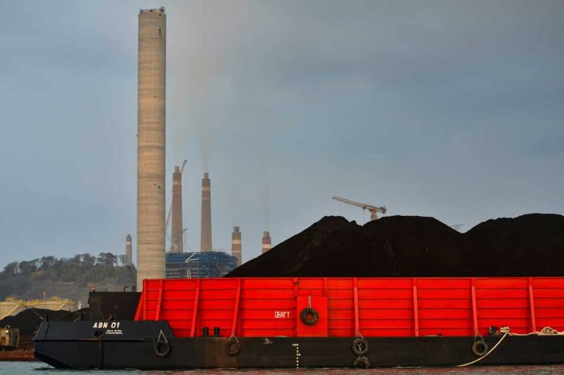 A barge carries coal to the dock next to the Suralaya coal-fired power plant in Cilegon, in Indonesia's Banten province A barge carries coal to the dock next to the Suralaya coal-fired power plant in Cilegon, in Indonesia's Banten province