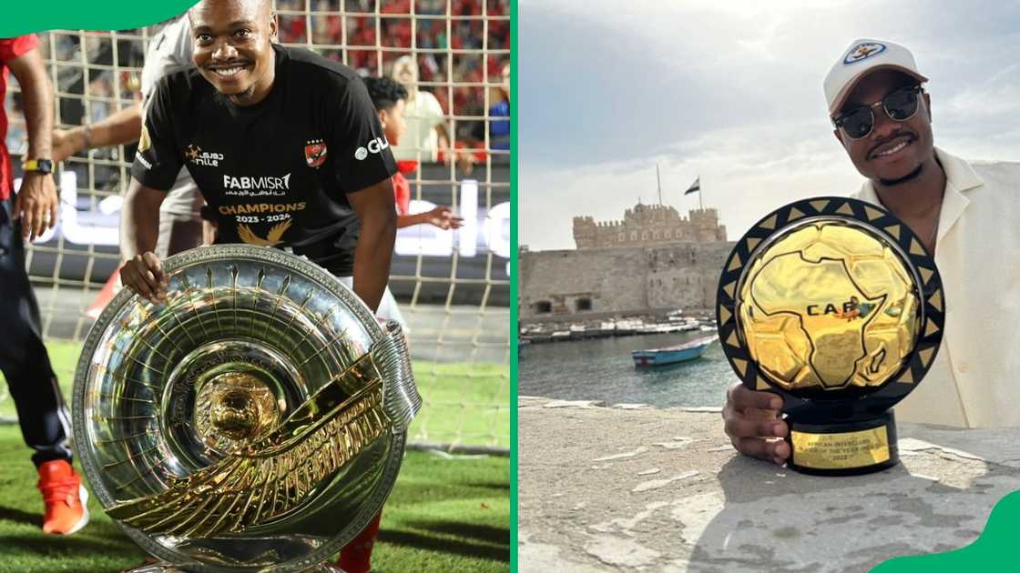 South African footballer Percy Tau poses with trophies South African footballer Percy Tau poses with trophies