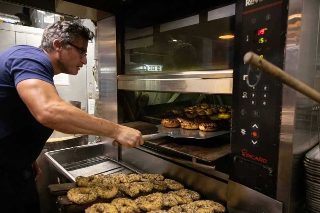 Andrew Martinez, seen here, and his wife Ashley Dikos have struggled to keep up with demand since opening Bo's Bagels in a part of Harlem that had been a bagel desert in a city long known for the deliciously doughy baked circles Andrew Martinez, seen here, and his wife Ashley Dikos have struggled to keep up with demand since opening Bo's Bagels in a part of Harlem that had been a bagel desert in a city long known for the deliciously doughy baked circles