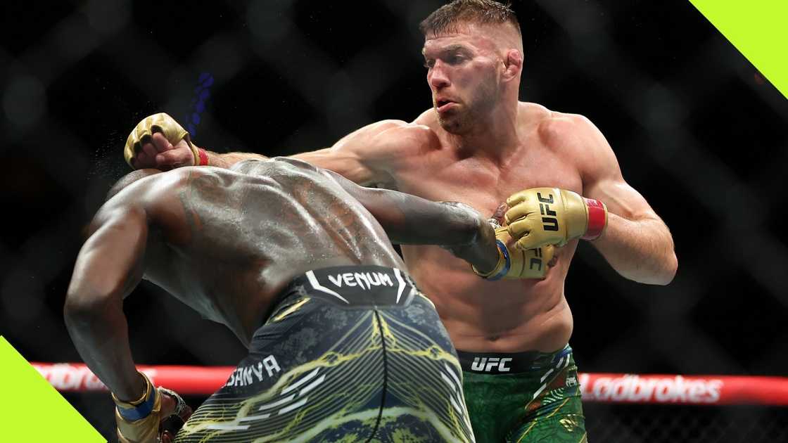 Dricus Du Plessis defeats Israel Adesanya in the Middleweight Championship fight during UFC 305. Dricus Du Plessis defeats Israel Adesanya in the Middleweight Championship fight during UFC 305.