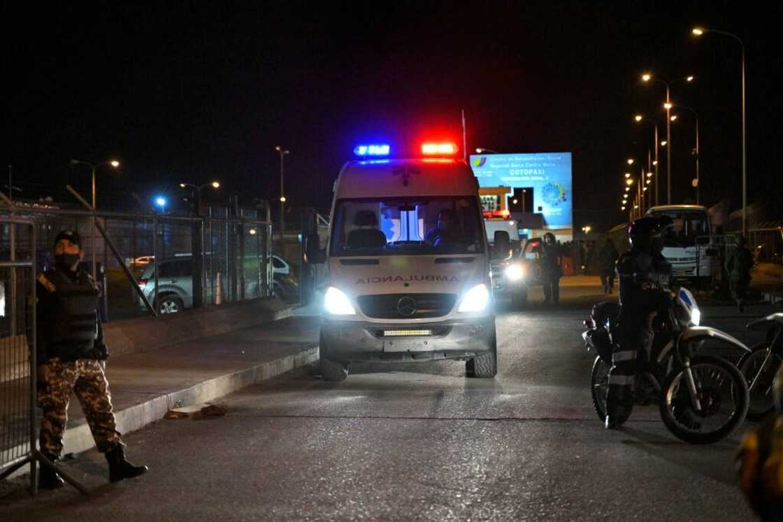 An ambulance leaves the prison, where repeated outbreaks of deadly violence linked to drug trafficking have occurred