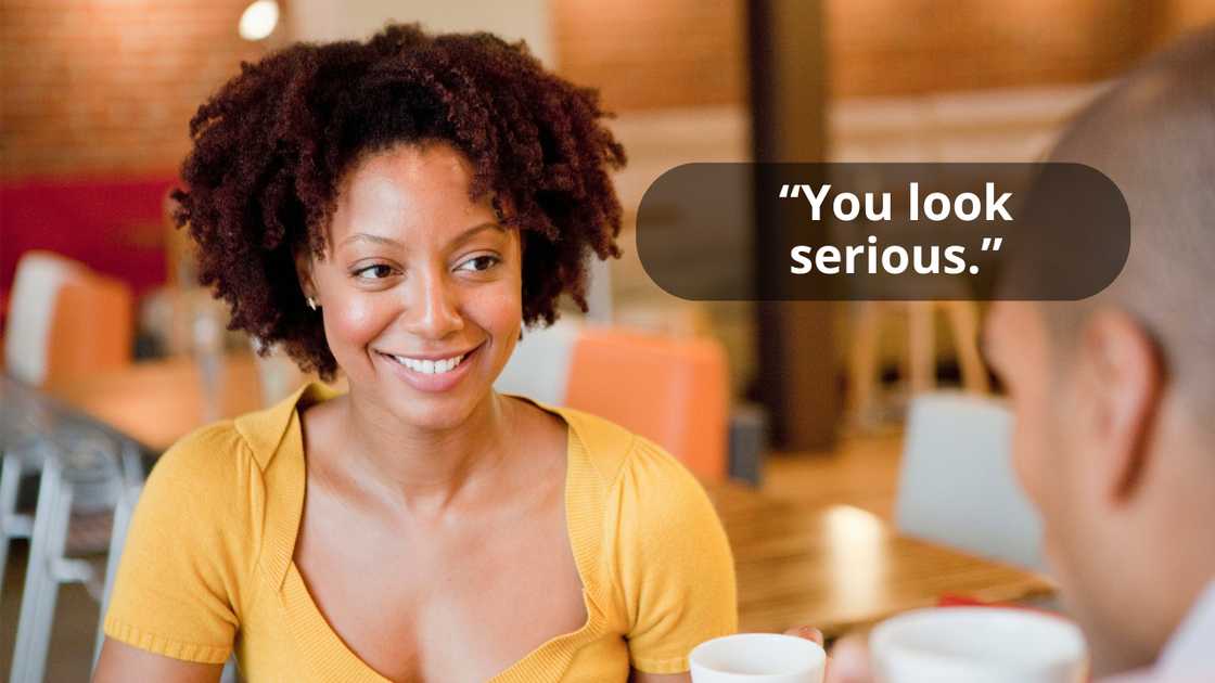 A beautiful woman talking to a man while smiling A beautiful woman talking to a man while smiling