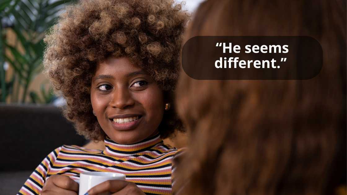 A woman talking to a lady while they are having a drink A woman talking to a lady while they are having a drink