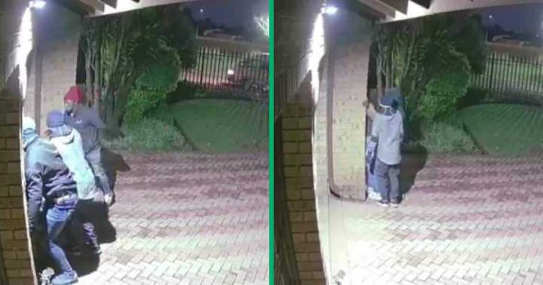 A Twitter video shows a group of men trying to break into a house. A Twitter video shows a group of men trying to break into a house.